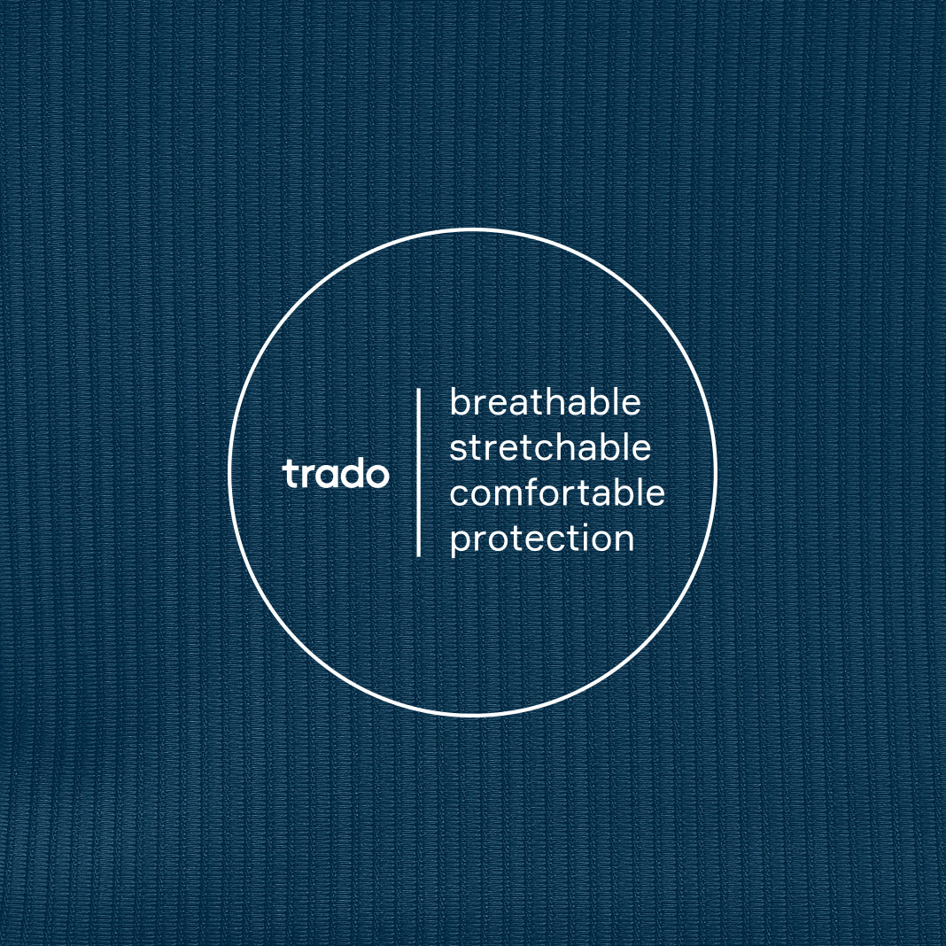 Text 'trado breathable stretchable comfortable protection' on a textured midnight blue background
