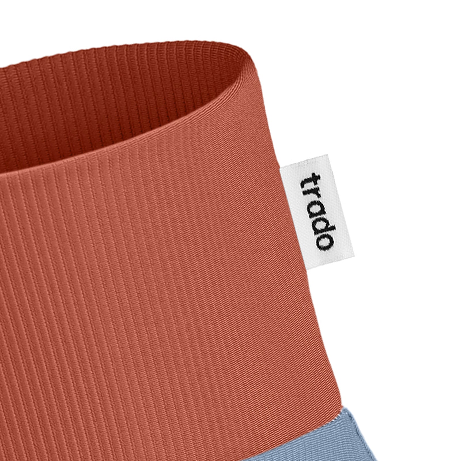 trado label on the trado trail gaiter vermilion baby blue